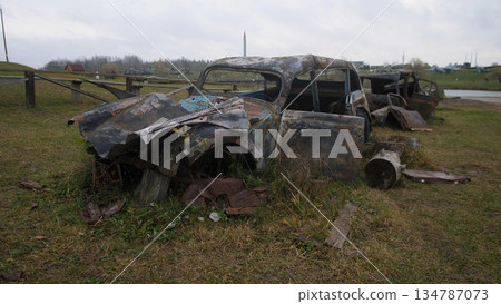 vehicles damaged chaos, scattered wreckage on hillside, disordered cars and twisted metal in chaos scene, scattered wrecked automobiles on grassy knoll with mangled metal and burnt panels vehicles damaged chaos, scattered wreckage on hillside, disordered cars and twisted metal in chaos scene, scattered wrecked automobiles on grassy knoll with mangled metal and burnt panels 134787073