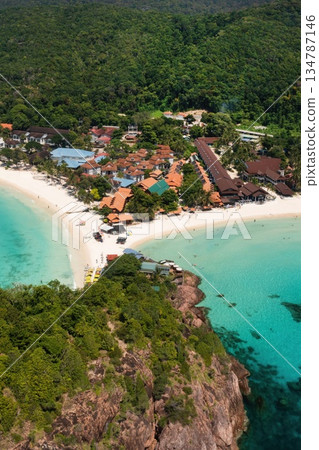 Stunning views of long beach with clear turquoise waters and tourists on Redang Island. Malaysia Stunning views of long beach with clear turquoise waters and tourists on Redang Island. Malaysia 134787146