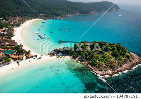 Stunning views of the beach with clear turquoise waters and lush green mountains of Redang Island. Malaysia Stunning views of the beach with clear turquoise waters and lush green mountains of Redang Island. Malaysia 134787151