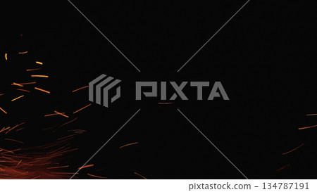 sparks and embers from campfire flying over black background 134787191