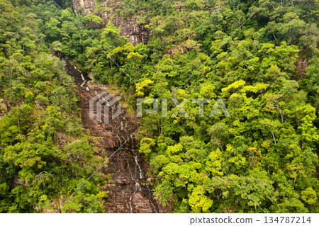 Temurun Waterfall is surrounded by a lush green forest in a remote location on Langkawi Island. Malaysia 134787214
