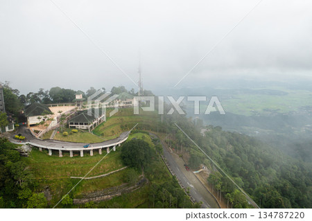 Aerial view of GUNUNG RAYA mountain peak on Langkawi Island with telecommunication tower and abandoned hotel 134787220