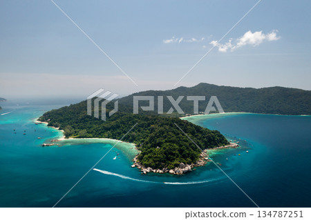 Stunning bird's-eye view of a tropical island with lush greenery and clear waters on a sunny day in the Perhentian Islands. Malaysia 134787251