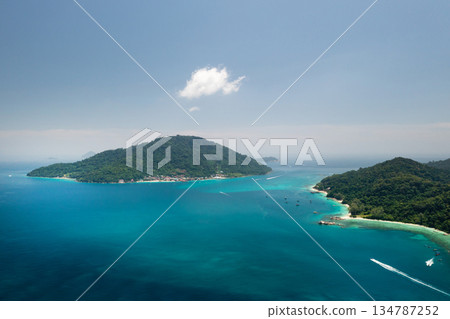 Stunning bird's-eye view of a tropical island with lush greenery and clear waters on a sunny day in the Perhentian Islands. Malaysia 134787252