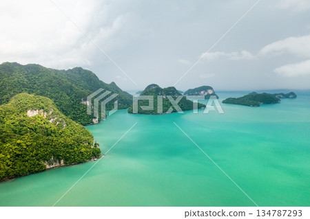 Stunning aerial view of emerald waters and lush islands in a tropical paradise at KILIM Geopark on Langkawi Island. Malaysia 134787293