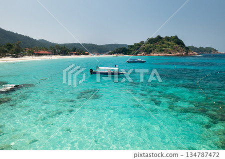 Boat and turquoise sea near LONG BEACH on Redang Island, Malaysia. A tropical beach in the South China Sea 134787472