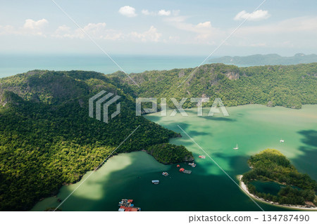 Scenic aerial view of the green mountains and river in KILIM Park on a sunny day with a clear sky. Langkawi. Malaysia Scenic aerial view of the green mountains and river in KILIM Park on a sunny day with a clear sky. Langkawi. Malaysia 134787490