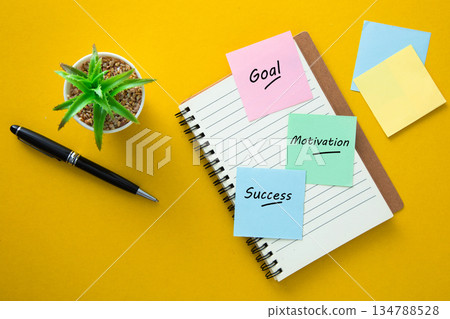 Goal motivation success written on sticky notes 134788528