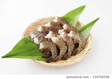 Headless black tiger shrimp served in a colander 134788599
