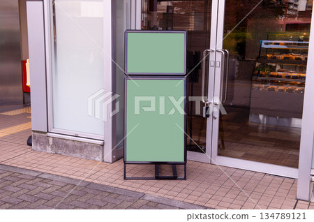 Large blank billboard on a street wall, banners with room to add your own text 134789121