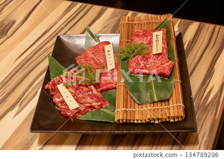 Wagyu beef loin and skirt steak served on a black plate Wagyu beef loin and skirt steak served on a black plate 134789206