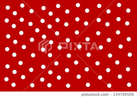 A festive red background filled with evenly spaced white polka dots, perfect for seasonal wrapping or decorative projects. 134789509