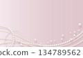 Realistic pearls on a pink background 134789562