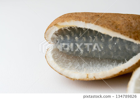 Indoor photo of Akebia fruit on white paper 10 134789826