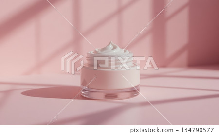 Open glass jar with white cosmetic facial cream on pink background Open glass jar with white cosmetic facial cream on pink background 134790577