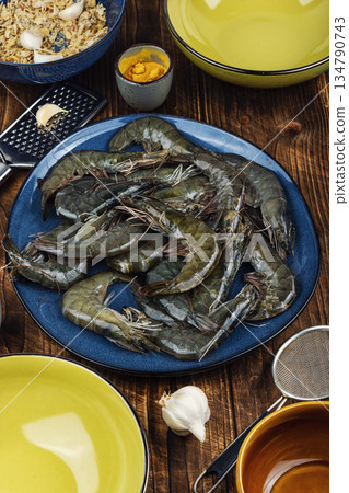 Seafood on a plate, pile of raw langoustines. 134790743