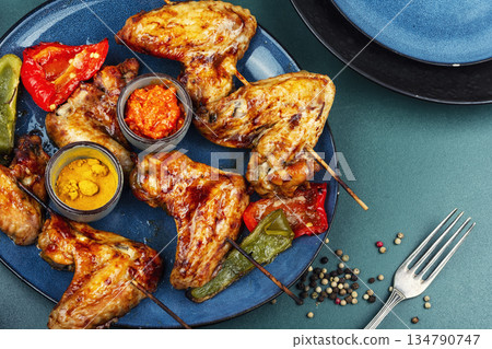 Grilled Chicken Wings on Wooden Skewers Grilled Chicken Wings on Wooden Skewers 134790747