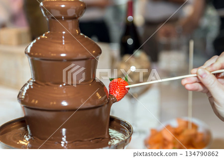 Vibrant chocolate fountain Vibrant chocolate fountain 134790862