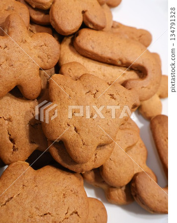 Golden Gingerbread Cookies in Fun Shapes, Perfect for Holiday Baking, Family Gatherings, and Sharing Golden Gingerbread Cookies in Fun Shapes, Perfect for Holiday Baking, Family Gatherings, and Sharing 134791328