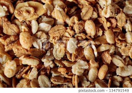 Crunchy Granola with Oats Raisins and Cereal Flakes Close-Up 134791549
