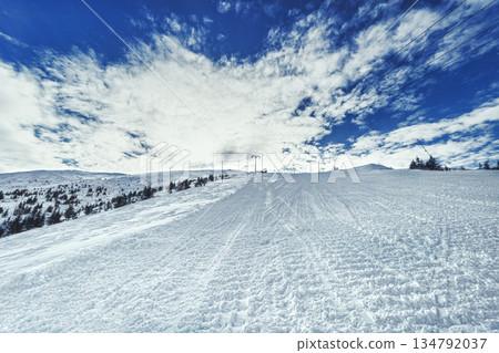 Dramatic Winter Twilight Over Mountain Ski Resort 134792037