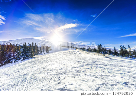 Dramatic Winter Twilight Over Mountain Ski Resort 134792050