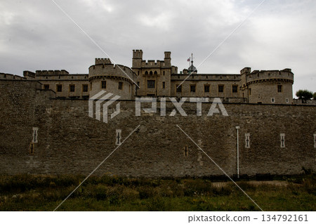 Tower and Wall of Historic Castle With Cloudy Sky in Background Tower and Wall of Historic Castle With Cloudy Sky in Background 134792161