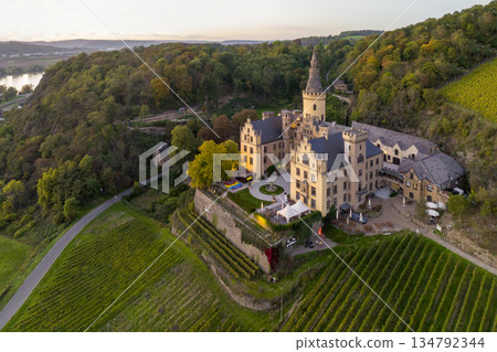 Aerial shot of the castle Drachenburg Siebengebirge at sunset near Bonn in Nord-Rhein Westfallen. Konigswinter Aerial shot of the castle Drachenburg Siebengebirge at sunset near Bonn in Nord-Rhein Westfallen. Konigswinter 134792344
