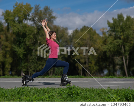 Caucasian woman roller skating in park.  134793465