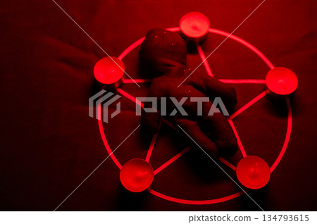 Voodoo doll on a pentagram. Witch spells. 134793615