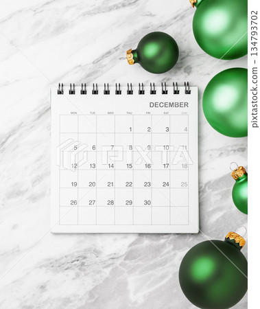 Calendar December with green christmas ball decoration on marble table background Calendar December with green christmas ball decoration on marble table background 134793702