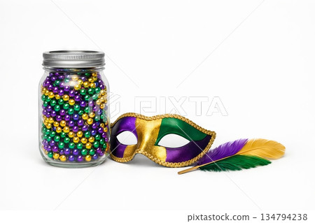 Mardi gras mask and beads with colorful feathers isolated on white background. concept of festive celebration, carnival accessories, traditional party decor 134794238