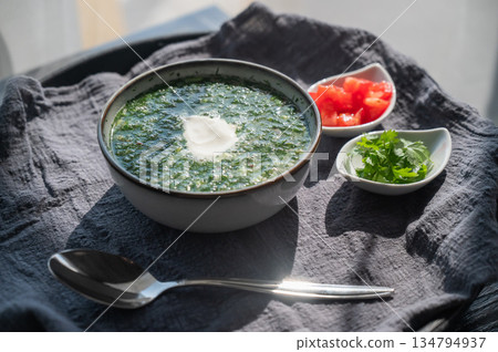 Traditional Russian lunch in a cafe. Top view of okroshka. Traditional Russian lunch in a cafe. Top view of okroshka. 134794937