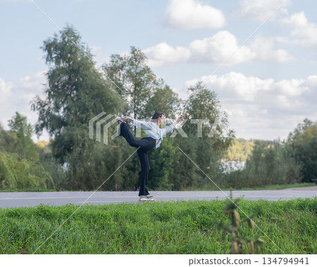 Caucasian woman roller skating in park. Caucasian woman roller skating in park. 134794941