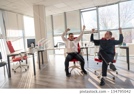 Two Caucasian men having fun at work. Two Caucasian men having fun at work. 134795042