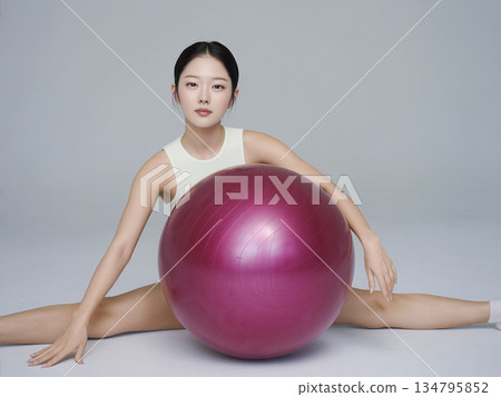 Woman is holding a pink ball 134795852