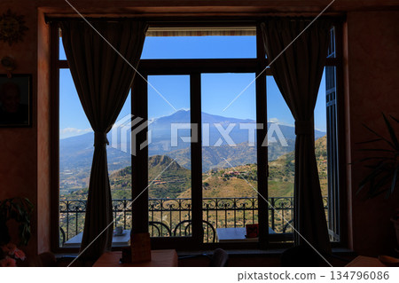 View from the window of the mountains and Mount Etna. Castelmola. Sicily View from the window of the mountains and Mount Etna. Castelmola. Sicily 134796086