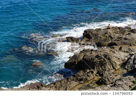 Rocky coastline with waves in Cefalu, Sicily Rocky coastline with waves in Cefalu, Sicily 134796093
