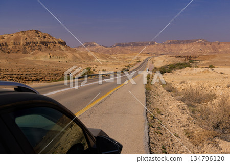 Scenic Desert Road in Israel Under Blue Sky 134796120