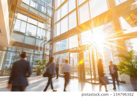 Bright Office Interior with Glass Walls and Natural Light Flowing In 134796382