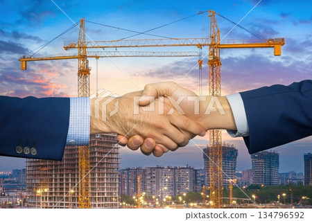 Business Partnership in Real Estate Development with Construction Background and Handshake 134796592