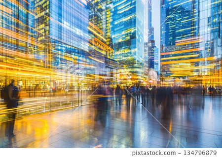 Modern Glass Architecture with Dynamic Exposure and Motion in Urban Cityscape at Dusk 134796879