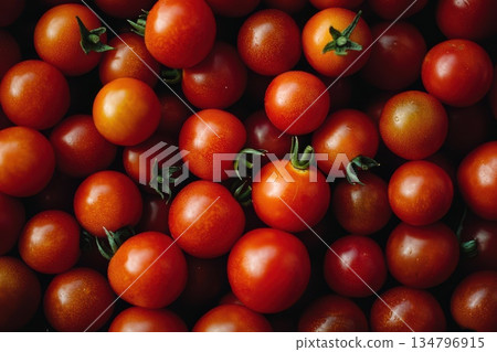 Fresh Cherry Tomatoes Arranged in Bold Composition on Dark Background 134796915