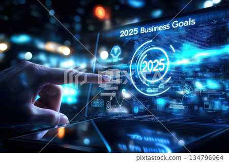 Digital Tablet Displaying Business Goals for 2025 with Futuristic Elements 134796964