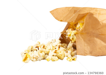 Popcorn in a brown paper bag isolated on white background 134798360