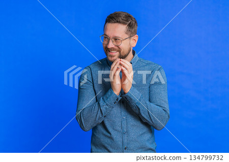 Sneaky cunning mature man thinking over devious villain idea, cheats, jokes, pranks, evil plan 134799732