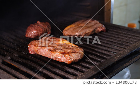 Steakhouse. Steaks are roasted on a Josper oven. Frying a steak on a josper. 134800178