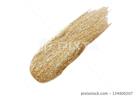 A sample of gold nail polish with a shimmer and metallic effect. Isolated on a white background. 134800207