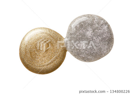 A sample of silver and gold nail polish with a shimmer and metallic effect. Isolated on a white background. 134800226