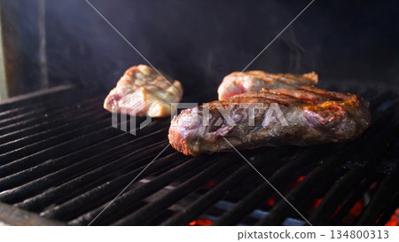 Steakhouse. Steaks are roasted on a Josper oven. Frying a steak on a josper. 134800313